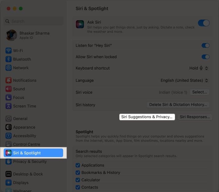 Navigate to System Settings, Siri & Spotlight, and click on Siri Suggestions & Privacy