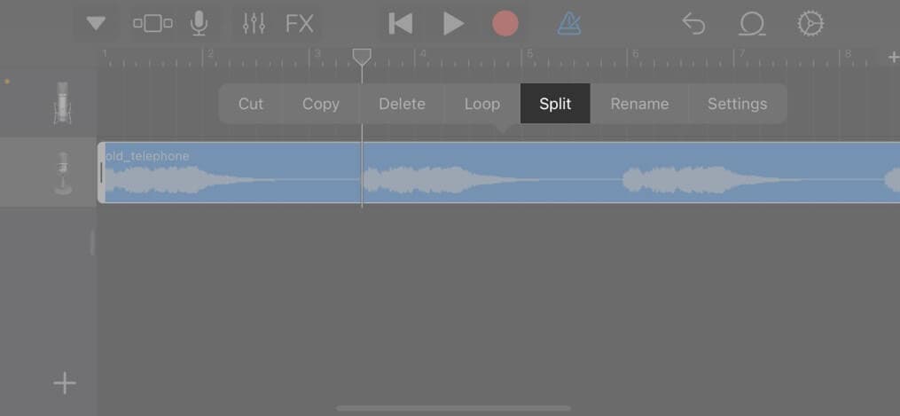 Double tap on song and select Split on iPhone