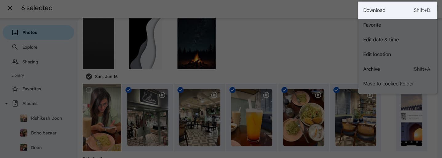 Download button on the Google Photos website to download selected photos.