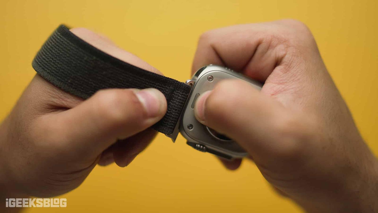 Removing an Apple Watch band.