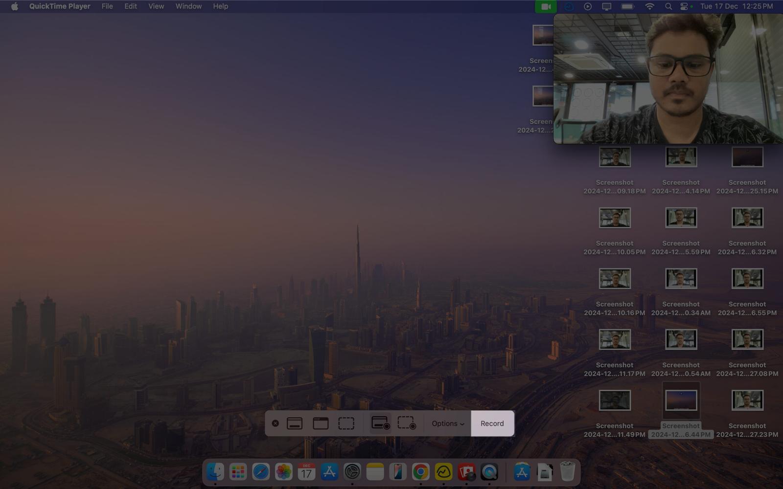 Clicking the record button to record the screen as well as the camera feed on a Mac.