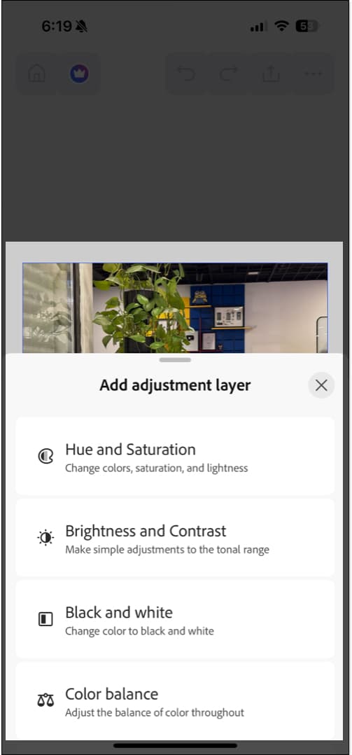 Image adjustment tools in the iPhone Photoshop app.