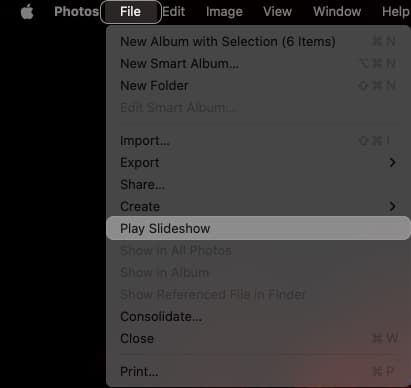 Using the Play Slideshow option in Photos app's File menu to start a slideshow.