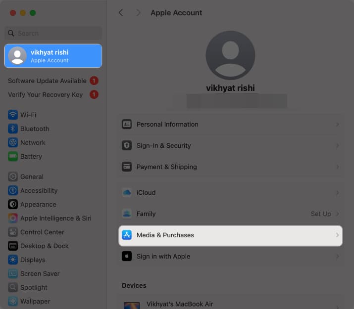 Accessing the Media & Purchases option in macOS System Settings.