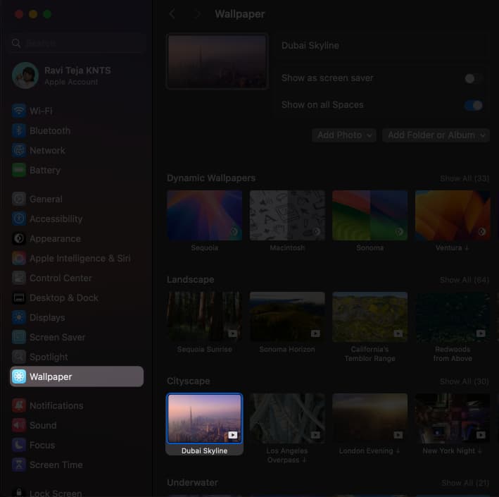 Choosing an Apple wallpaper and applying it to the desktop on a Mac.