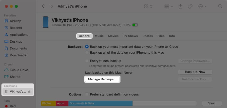 Accessing iPhone backups in the Finder app on a Mac.