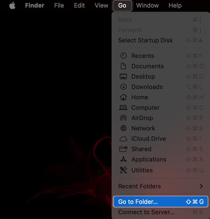 Accessing the Go to Folder option from Finder's menu bar.