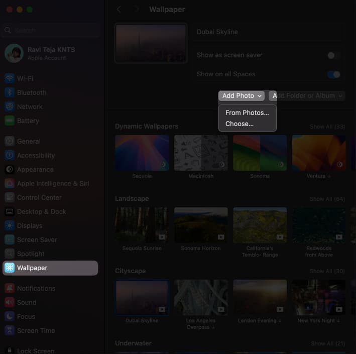 Accessing the Add Photo button options on the Wallpaper settings page in macOS System Settings app.