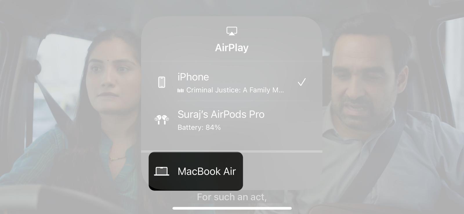 Choosing a device to stream content to via AirPlay on an iPhone.