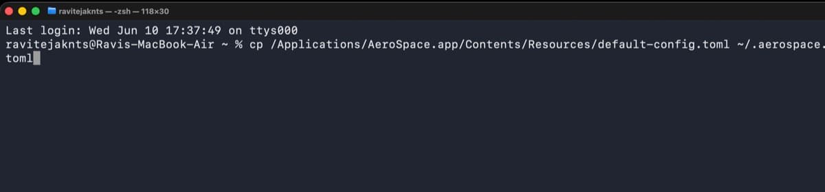 Terminal showing the command to copy the default AeroSpace config file