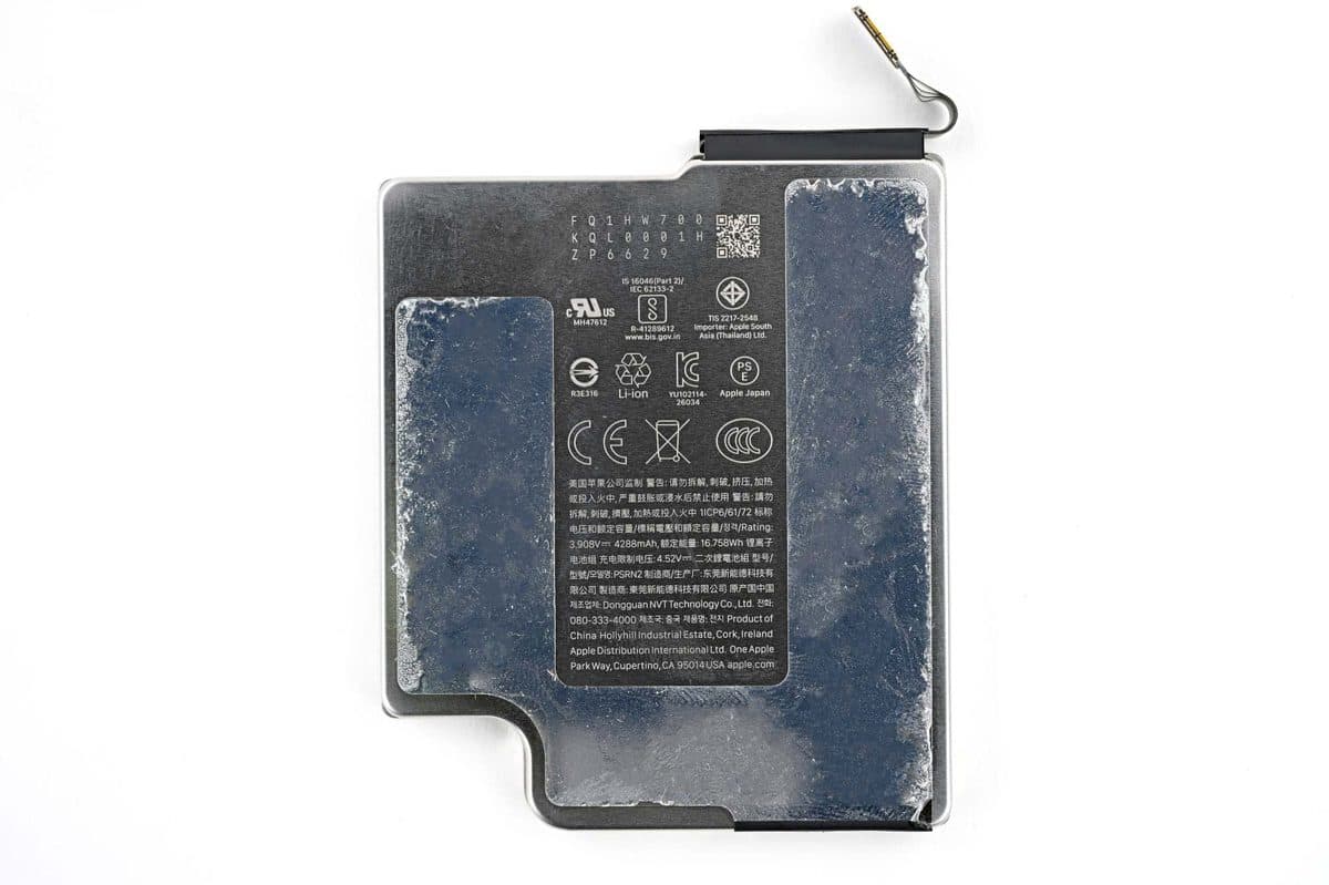 iFixit teardown view of iPhone 18 Pro battery tray removed showing 4,288 mAh cell and screwed-in metal tray
