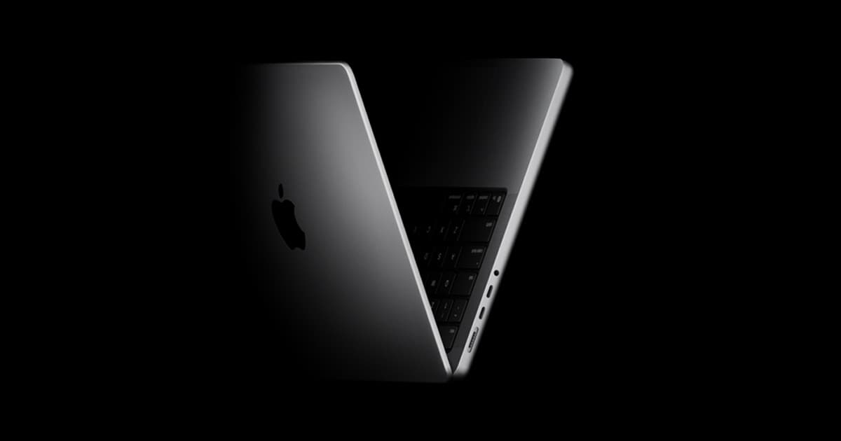 Apple MacBook Pro shown open at an angle as context for the rumored OLED MacBook tier