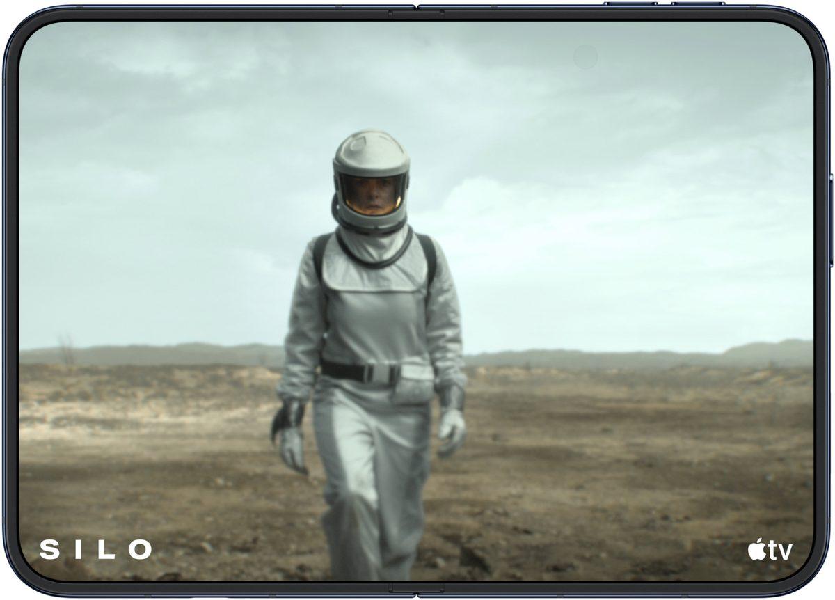 The open iPhone Duo in landscape, showing a scene from the Apple TV show Silo on its large inner screen