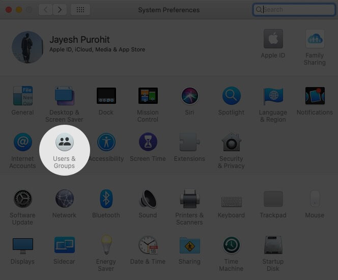 Click on User and Groups in System Preferences on Mac