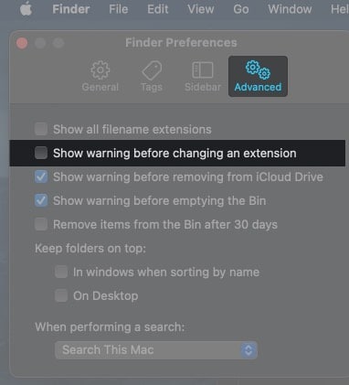 Uncheck Show warning before changing an extension on Mac
