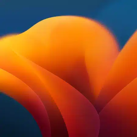 macOS Ventura newly launched wallpaper in shades of orange with a blue background