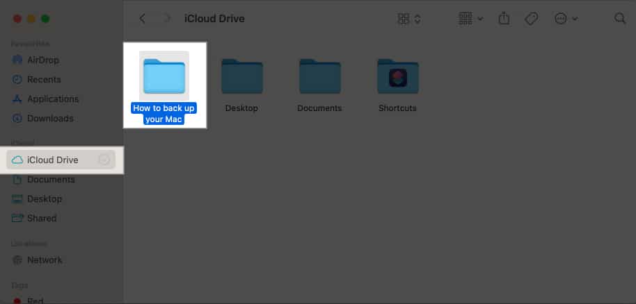 Open Finder, navigate to iCloud Drive, and drag and drop folders and files