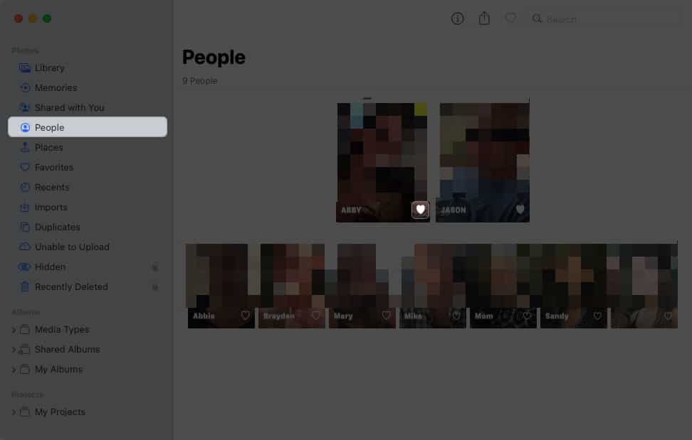 Select people, click the heart icon in photos
