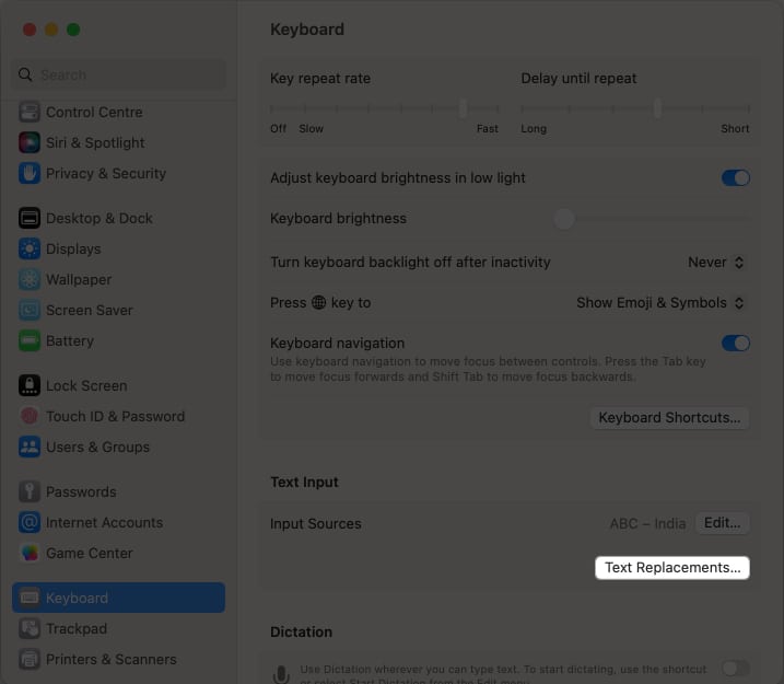 Click the text replacement option in keyboard settings