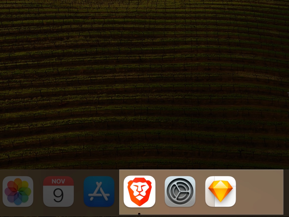 Drag and drop apps in dock separated by space