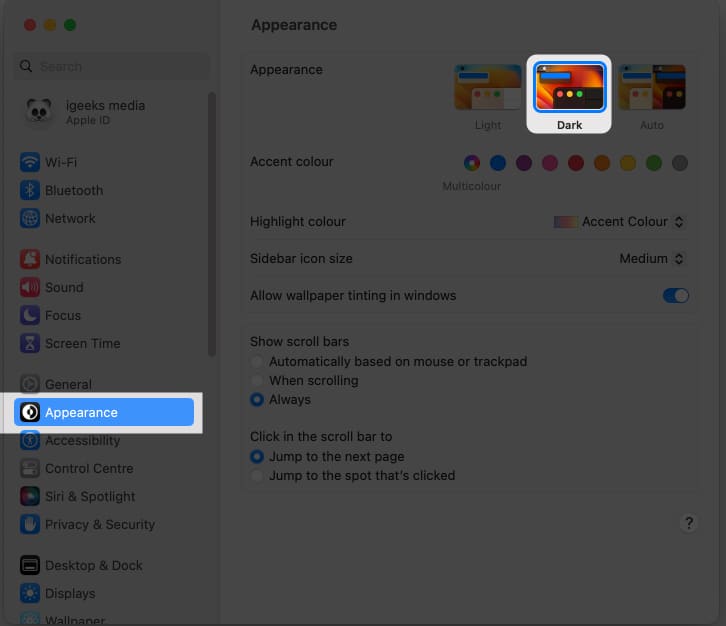 Click Appearance and select Dark in macOS Ventura