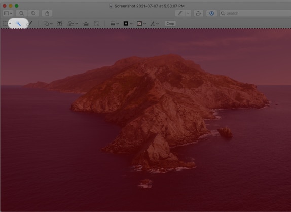 Click the Instant Alpha tool on Mac Preview
