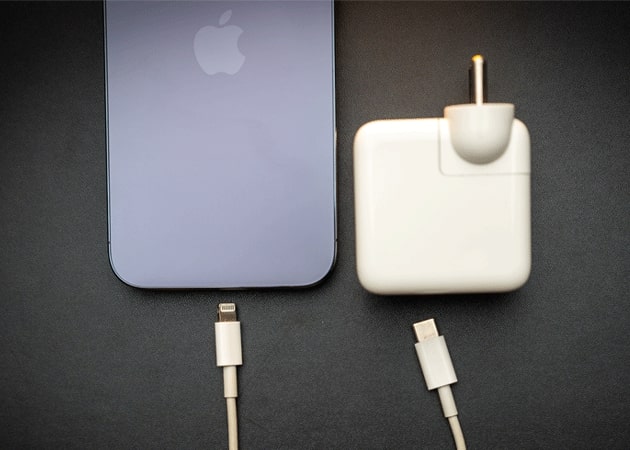 iPhone with charging brick and cable