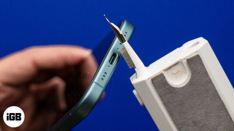 Cleaning an iPhone's charging port.