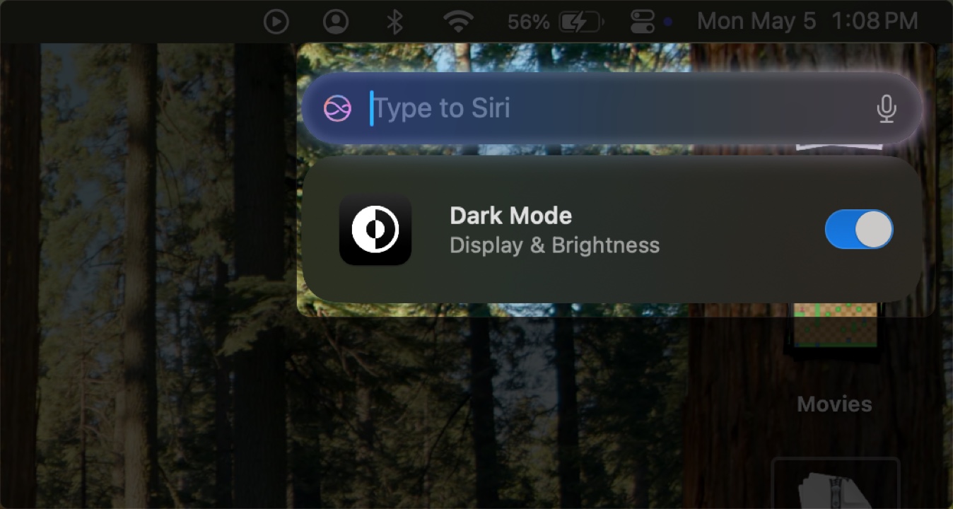 Turning on Dark Mode on a Mac using Siri.