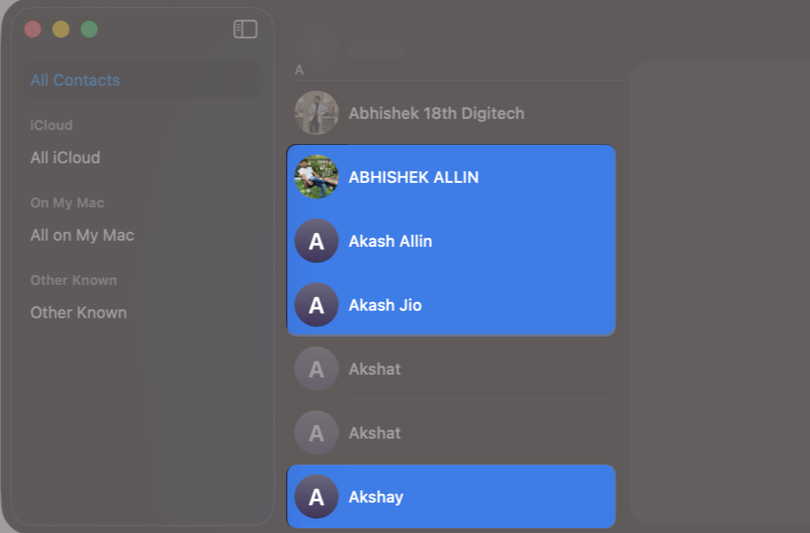 Command (⌘) + click to select multiple contacts.