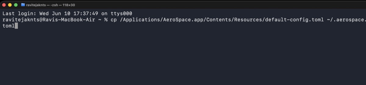 Terminal showing the command to copy the default AeroSpace config file