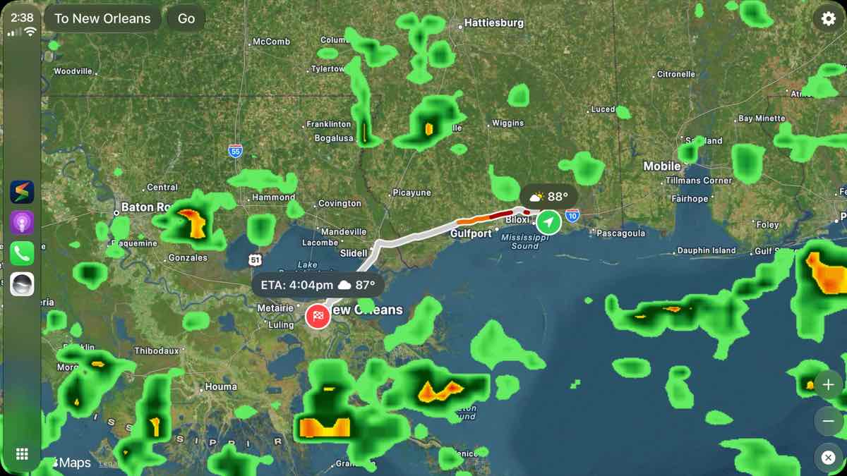 Storm Radar CarPlay interface showing a weather map, route, ETA, and rain alerts